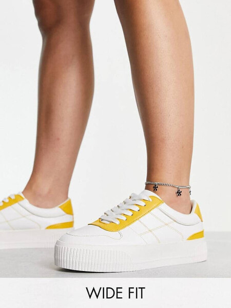 ASOS DESIGN Wide Fit Duet flatform lace up trainers in white/yellow