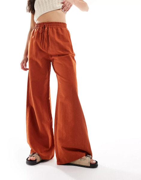 ASOS DESIGN tie waist wide leg trouser with linen in terracotta