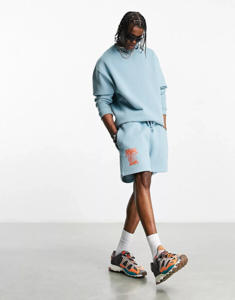 ASOS DESIGN co-ord oversized shorts in blue with multiplacement puff print