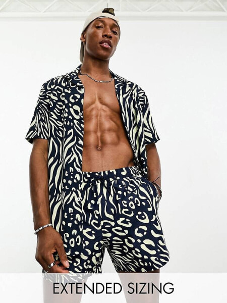 ASOS DESIGN co-ord swim shorts in short length in mixed animal print