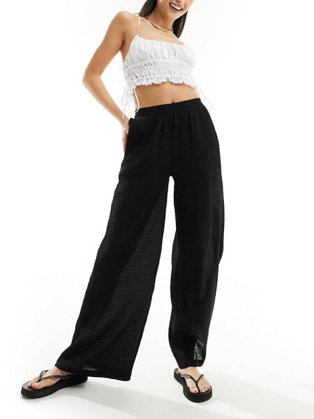 Bershka crinkle wide leg trousers in black