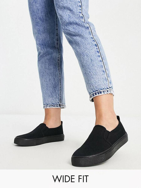 ASOS DESIGN Wide Fit Dotty slip on plimsolls in black