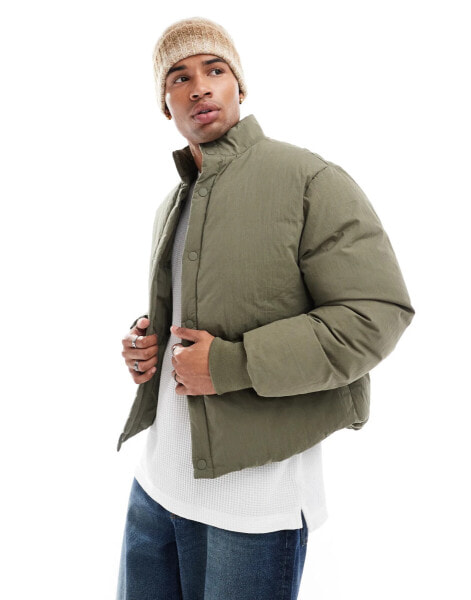 ASOS DESIGN oversized puffer jacket with concealed pockets and rib cuffs in green