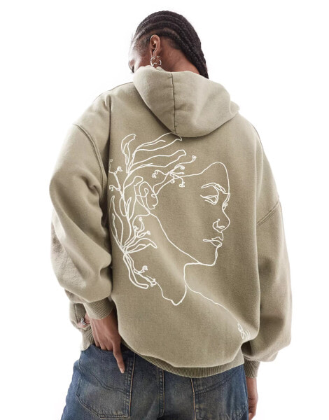 Reclaimed Vintage sketchy face hoodie in khaki