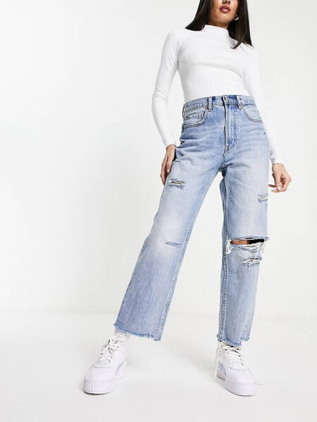 Stradivarius straight cropped jean with rips in medium blue 