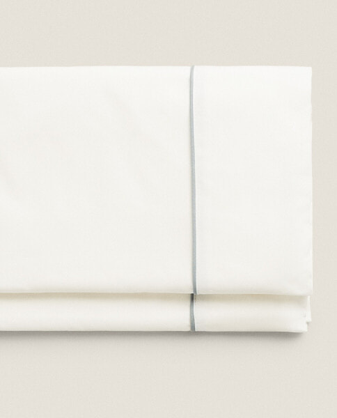 Flat sheet with coloured piping detail