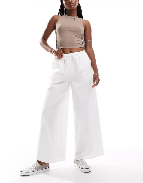 Labelrail x Olivia Grace Herring wide leg low rise textured trousers in white