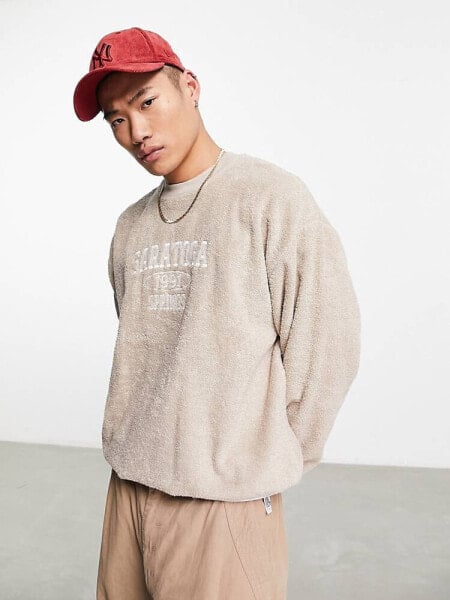 ASOS DESIGN oversized sweatshirt in beige towelling with city embroidery
