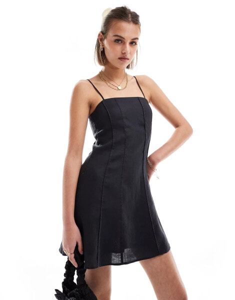 & Other Stories linen mini flippy dress with adjustable straps and panelled seams in black