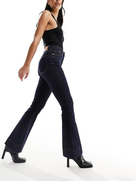 River Island high rise flared jeans in mid-blue