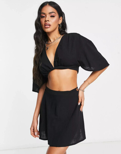 ASOS DESIGN natural beach wrap front mini skirt co-ord in black