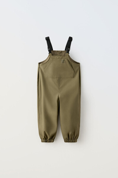 Water-repellent rubberised dungarees