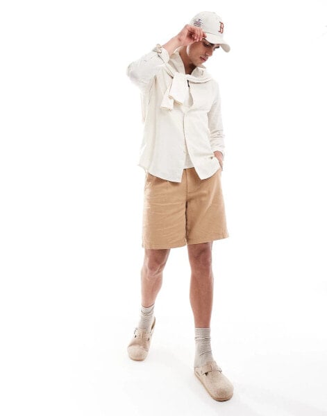 ASOS DESIGN pleated linen shorts in brown