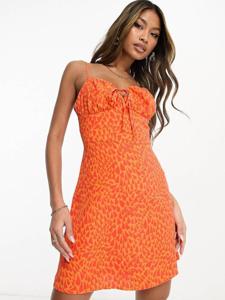 Collective the Label exclusive ruched bust mini dress in orange heart print