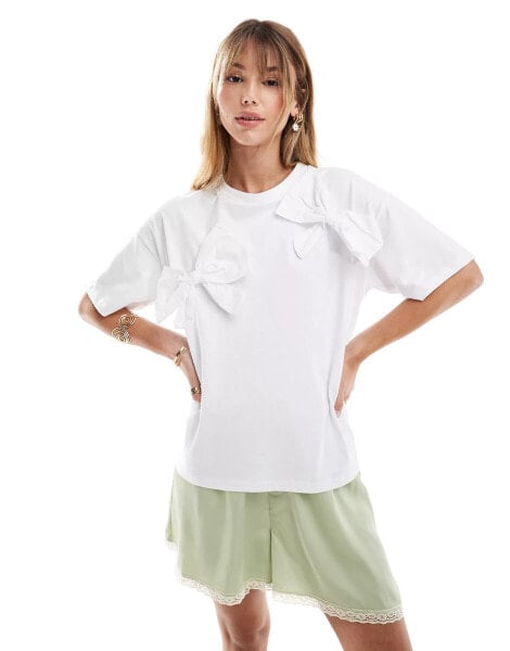 Object t-shirt with statement ribbon bows in white