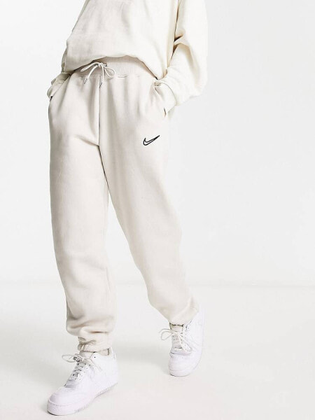 Nike Midi Swoosh phoenix fleece joggers in light orewood brown