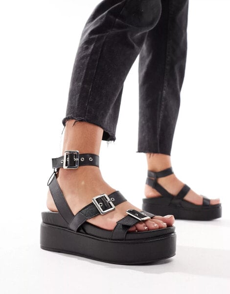 ASOS DESIGN Trombone chunky buckle detail flatforms in black