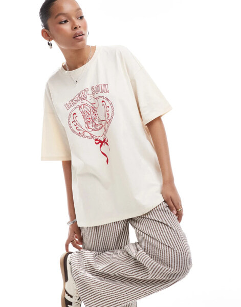 ASOS DESIGN oversized t-shirt with horse shoe cowboy graphic in ecru