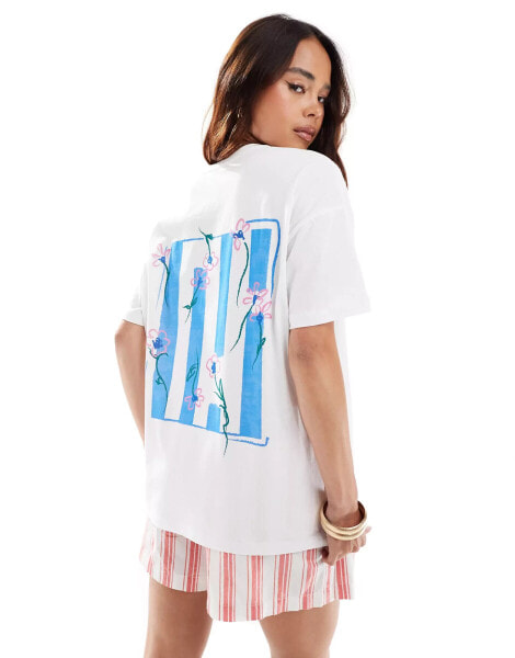 ASOS DESIGN oversized t-shirt with soft floral graphic in ivory