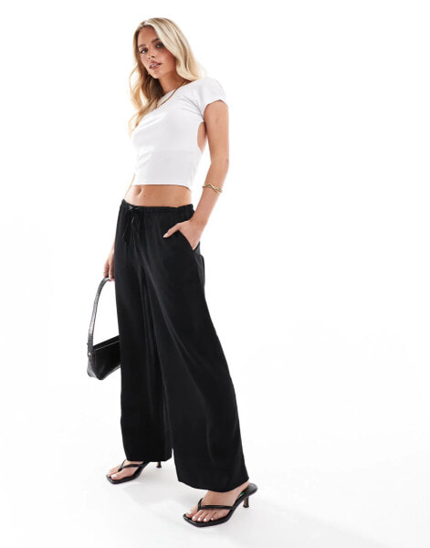 ASOS DESIGN Petite satin pull on trouser in black