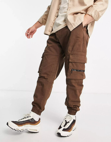 Bershka cuffed cargo trousers in brown exclusive at ASOS