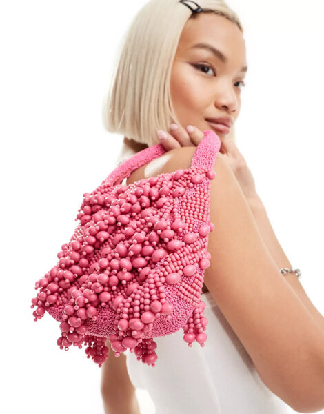 ASOS DESIGN beaded grab bag in hot pink