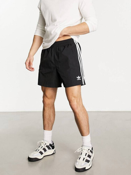 adidas Originals adicolor polyester 3 stripe shorter shorts in black 