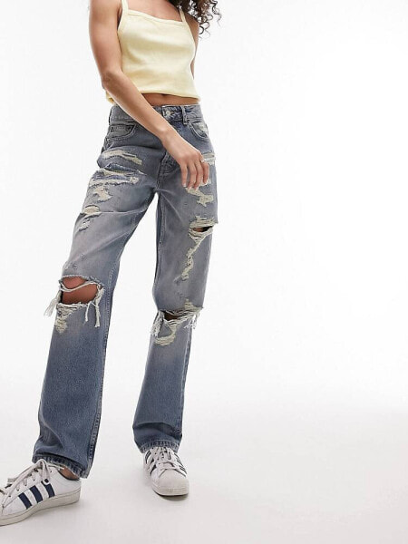 Topshop mid rise straight Dad jeans with extreme rip & repair in mid blue