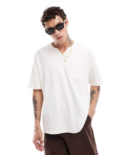 ASOS DESIGN relaxed t-shirt with v-neck and front pocket in cream