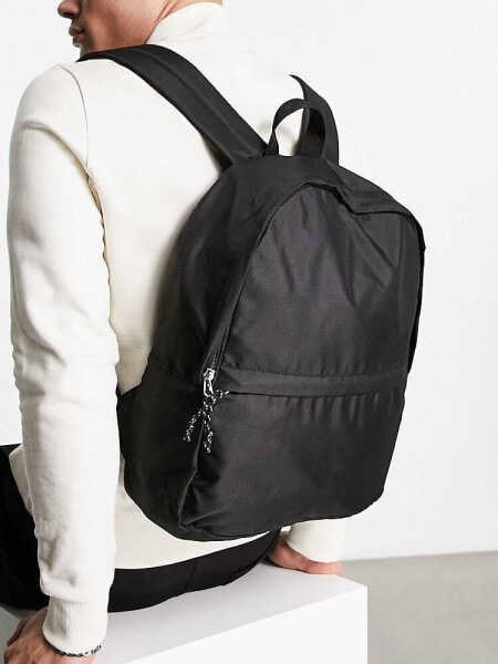 ASOS DESIGN backpack in black nylon with contrast puller 
