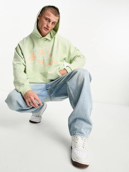 ASOS DESIGN oversized hoodie in green with sketch floral print