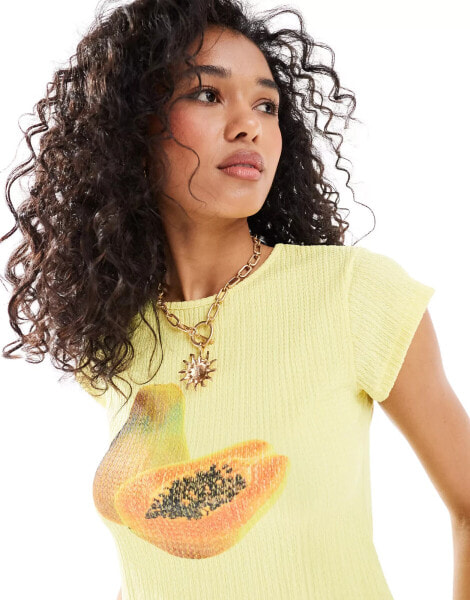 ASOS DESIGN textured shrunken baby tee with papaya graphic in lemon