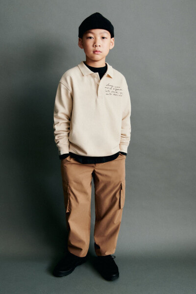 Polo sweatshirt with slogan