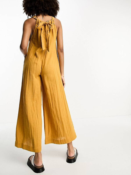 ASOS DESIGN minimal crinkle dungaree jumpsuit in mustard