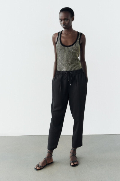 Cropped trousers with elasticated waistband