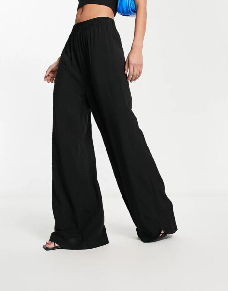 Urban Classics wide leg stretch trousers in black