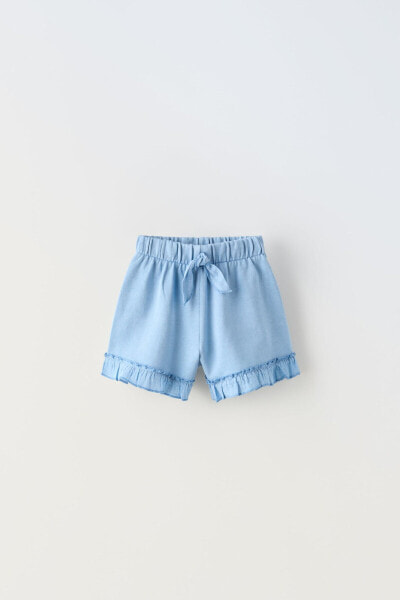 Plush bermuda shorts with bow and ruffles