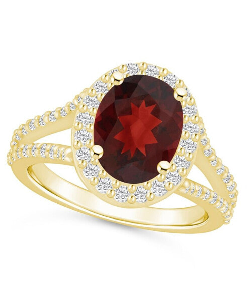 Garnet (3-1/10 ct. t.w.) and Diamond (3/4 ct. t.w.) Halo Ring in 14K Yellow Gold