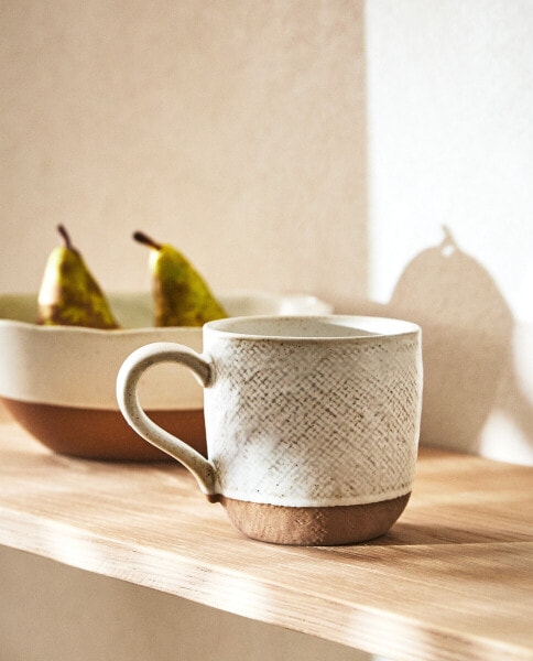 Mug with raised design