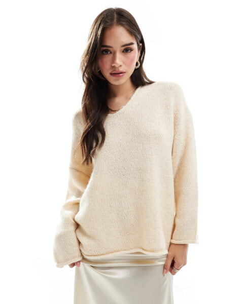 ASOS DESIGN loose knit v neck longline jumper in cream