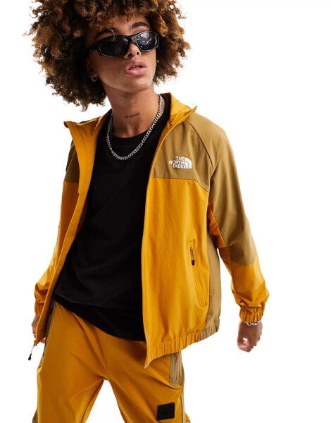 The North Face NSE shell track jacket in yellow and brown