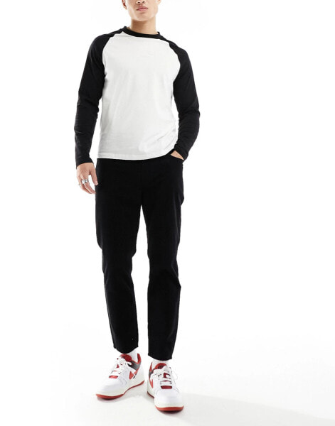 DTT cropped tapered fit cord trousers in black