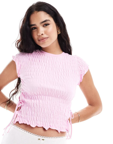 ASOS DESIGN textured short sleeve top with tie sides in pink