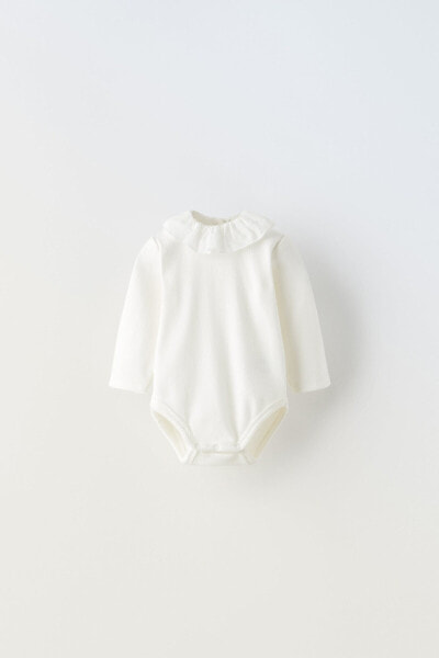 Contrast bodysuit with ruffle detail