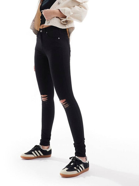 Dr Denim Lexy skinny fit mid waist with ripped knees in clean black wash