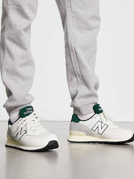 New Balance 574 trainers in off white and dark green