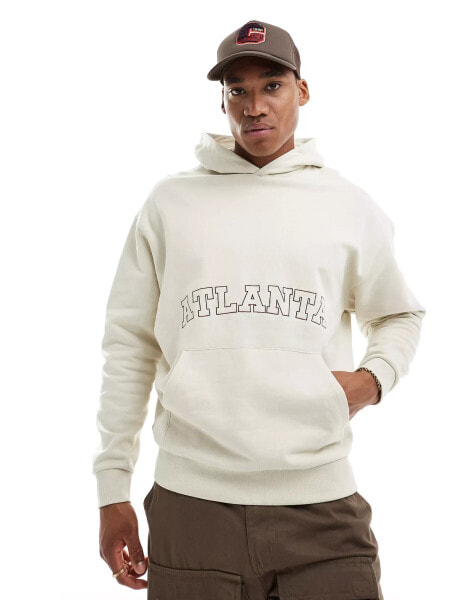 ASOS DESIGN oversized hoodie in beige with front city embroidery print