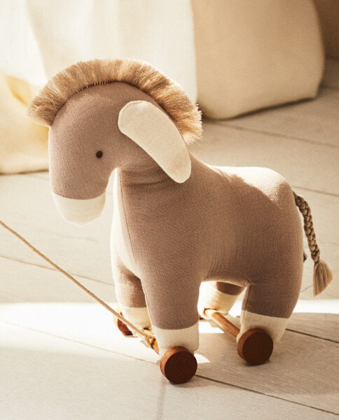 Children’s donkey soft toy with wheels