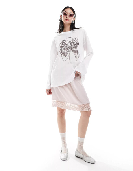 Monki long sleeve relaxed fit top with bow print in white