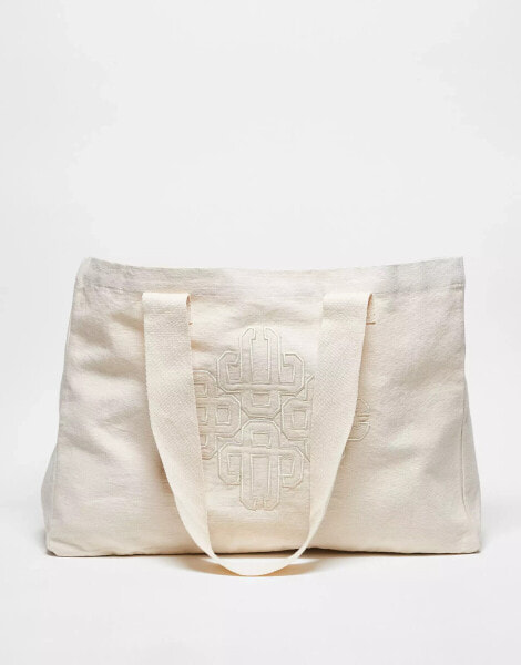 The Couture Club emblem logo tote bag in off white